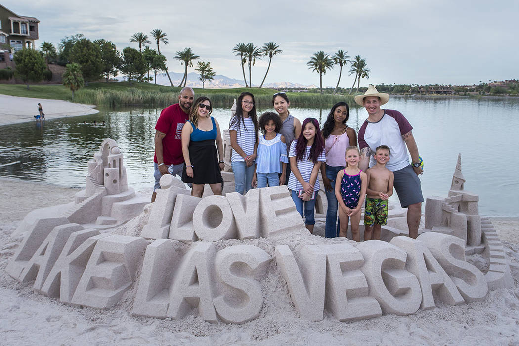 Lake Las Vegas residents build sand art at the beach. (Lake Las