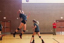 Arbor View outside hitter Hannah Goddard, left, jumps to serve the ball during volleyball pr ...
