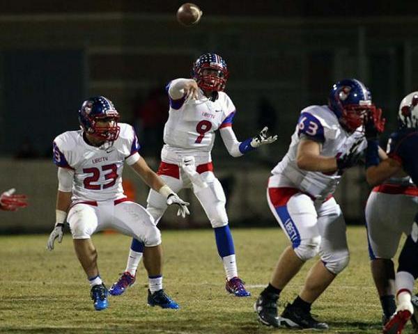 Liberty’s Tyler Newman (9) throws a pass on Friday night. Newman threw for 283 yards a ...