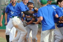 Green Valley’s Keaton Smith, red hair, celebrates with his teammates after he hit a ga ...