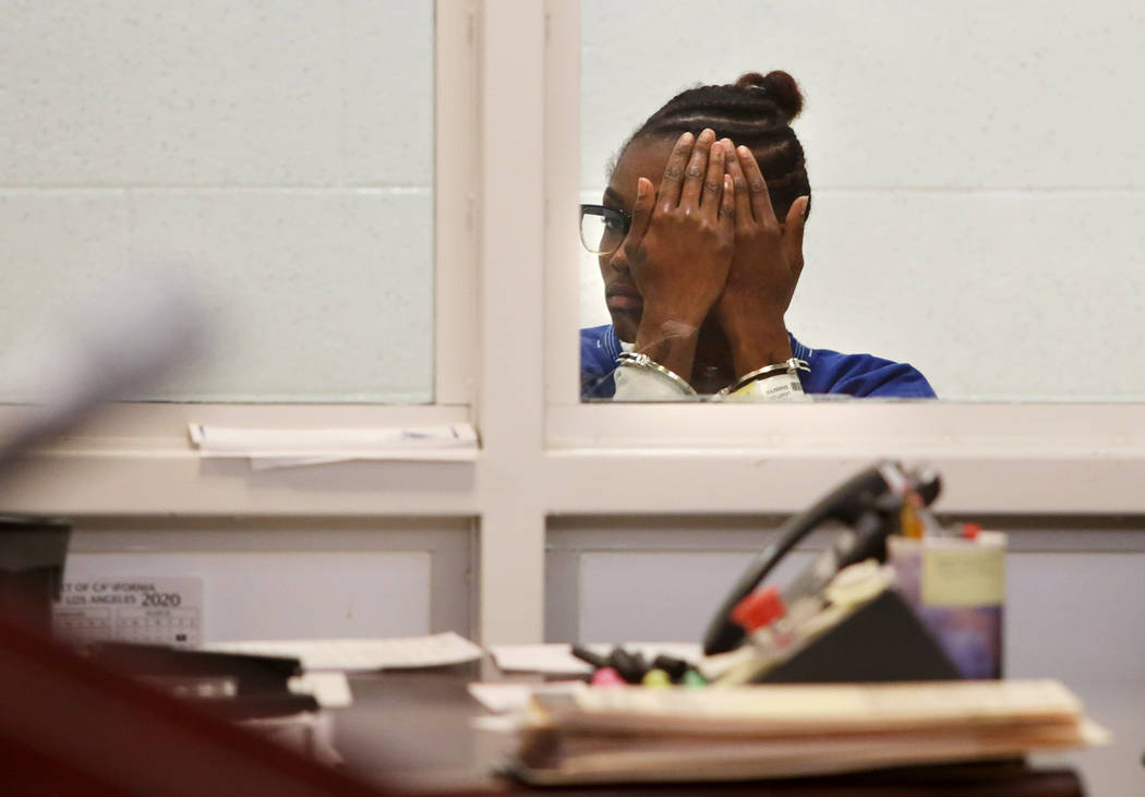 Shaniya Poche-Lawton covers her face while appearing in court at the Michael Antonovich Antelop ...