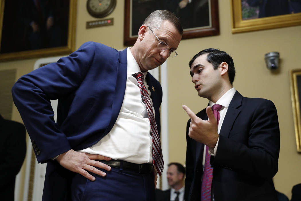 House Judiciary Committee ranking member Rep. Doug Collins, R-Ga., speaks to an aide before a H ...
