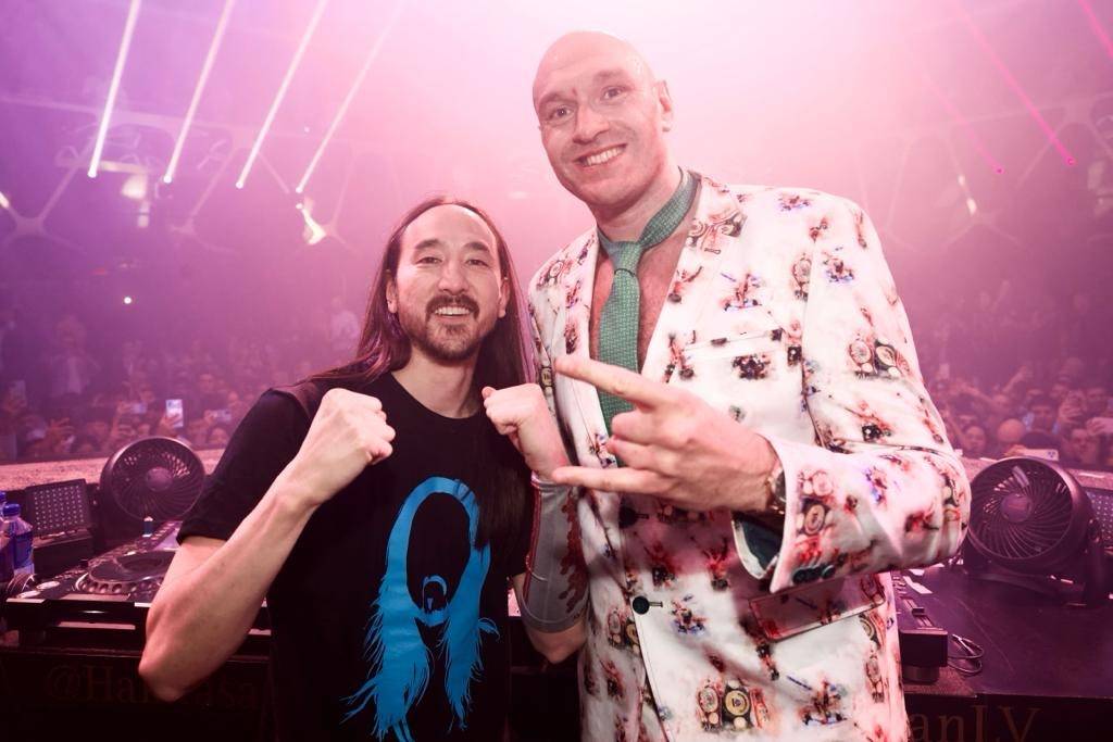 Tyson Fury, right, and DJ superstar Steve Aoki are shown celebrating his  seventh-round TKO vict … | Las Vegas Review-Journal