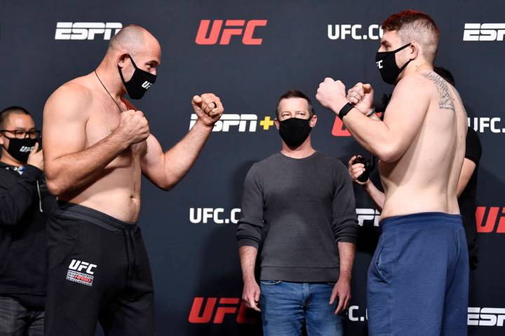 (L-R) Opponents Aleksei Oleinik of Russia and Chris Daukaus face off during the UFC weigh-in at ...