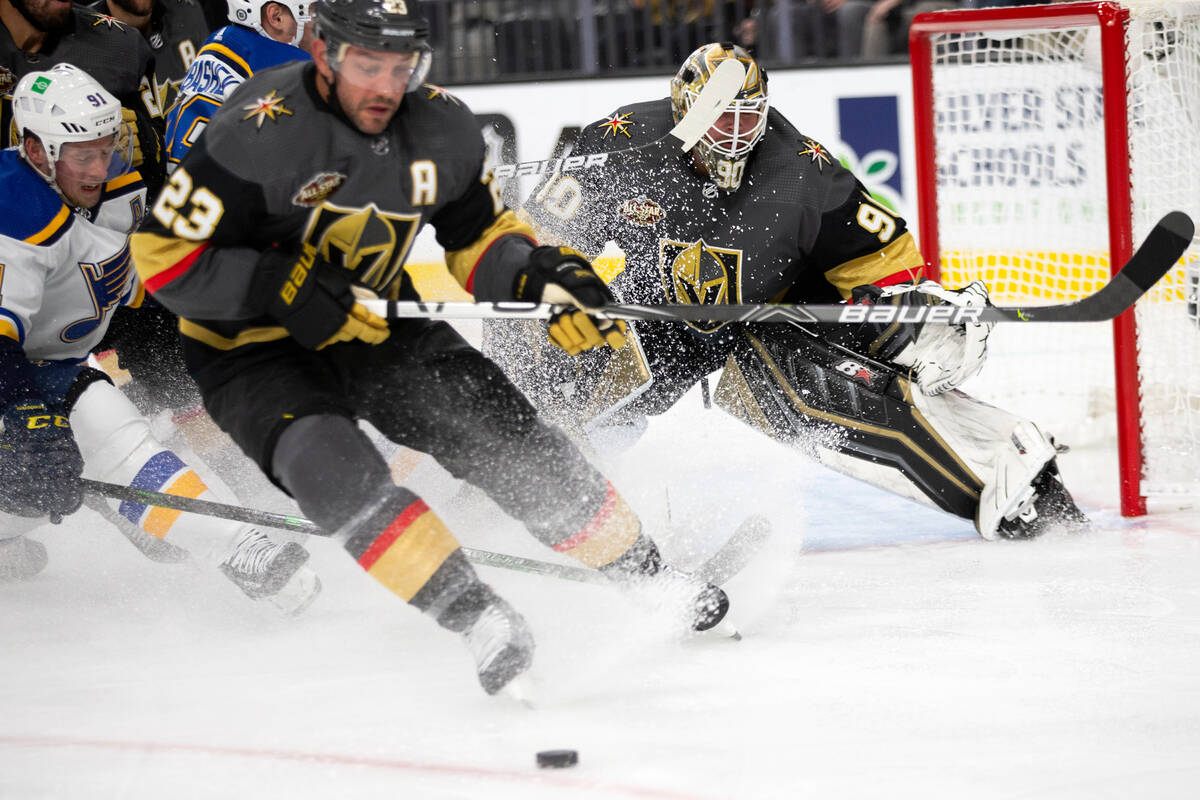 Vegas Golden Knights' Alec Martinez (23) saves a shot in front of