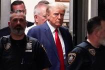 FILE - Former President Donald Trump is escorted to a courtroom, April 4, 2023, in New York. Tr ...