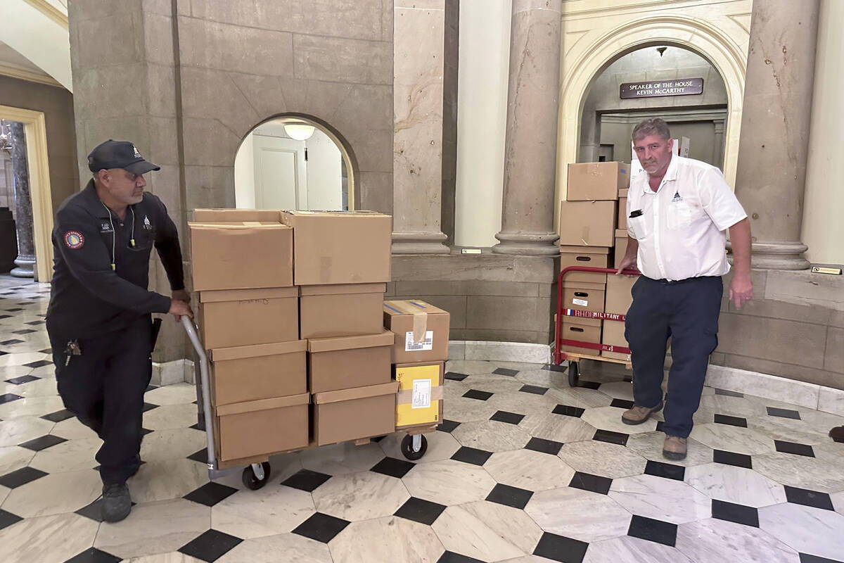 U.S. Capitol staff move boxes out of the Speaker of the House office, Wednesday, Oct. 11, 2023 ...
