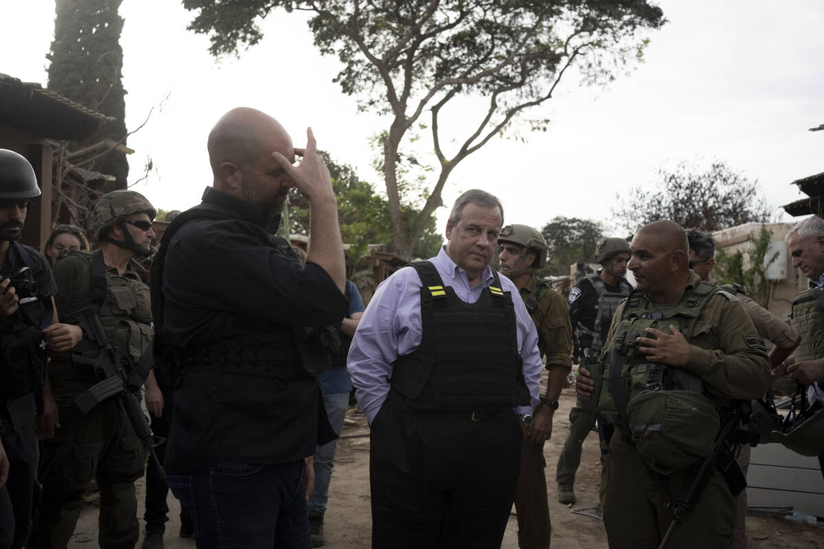 Former New Jersey Governor Chris Christie, center, visits Kibbutz Kfar Azza, near the Israel-Ga ...
