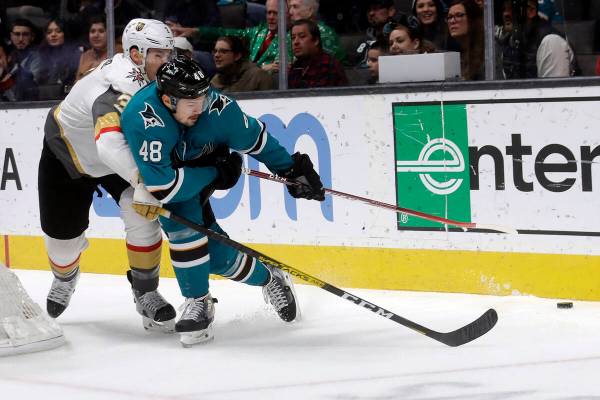 San Jose Sharks center Tomas Hertl (48) reaches for the puck in front of Vegas Golden Knights d ...
