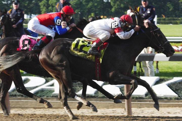 Sarava (12), ridden by Edgar Prado, wins the 134th running of the Belmont Stakes on Saturday, J ...