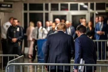 Former President Donald Trump prepares to leave the courthouse with attorney Todd Blanche after ...