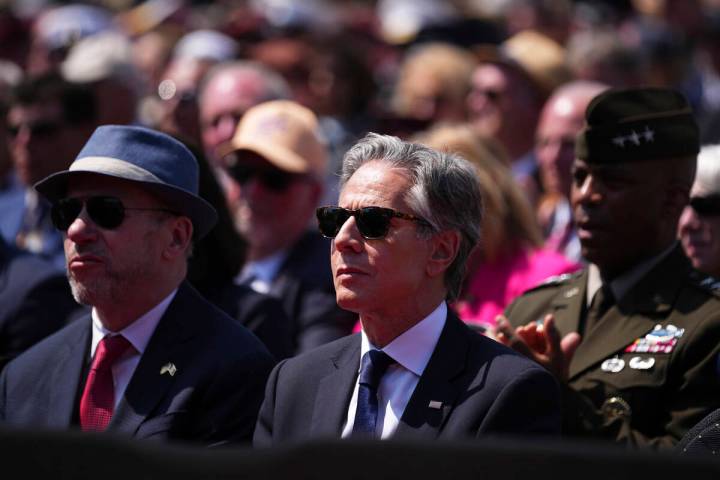 United States Secretary of State Antony Blinken listens to a speech during a commemorative cere ...