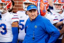 Florida coach Dan Mullen prepares to lead his team on the field prior to the start of an NCAA c ...