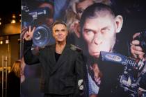 Robbie Williams poses for photographers upon arrival at the European premiere for the film 'Bet ...